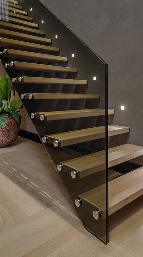 Floating staircase with black tinted glass