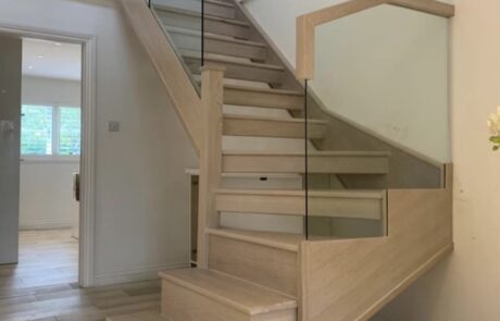 An example of a glass panel staircase renovation